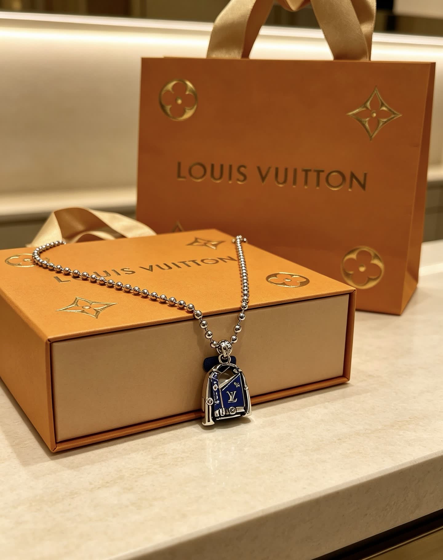 Louis Vuitton Silver Beaded Necklace with Blue Enamel Charm